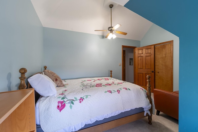 carpeted bedroom featuring ceiling fan, a closet, and vaulted ceiling