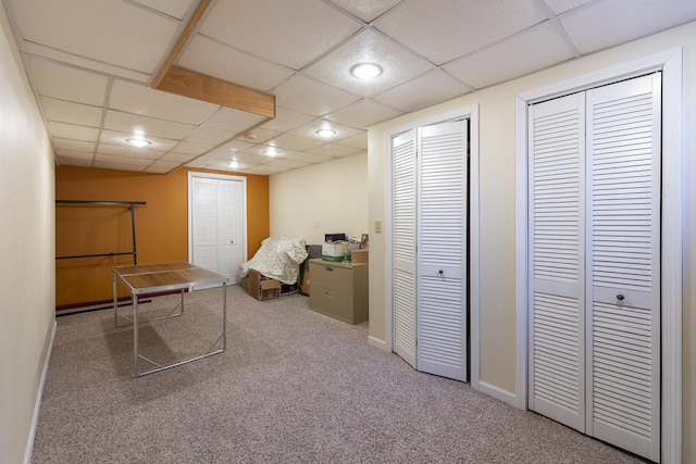 rec room featuring a paneled ceiling and carpet floors