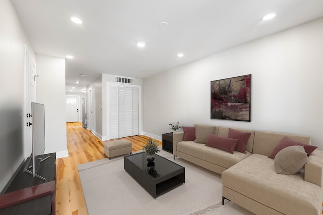 living room with hardwood / wood-style flooring