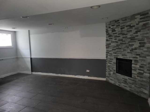 basement with a fireplace