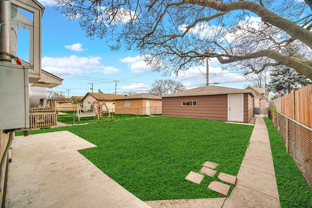 view of yard featuring an outbuilding and a patio area