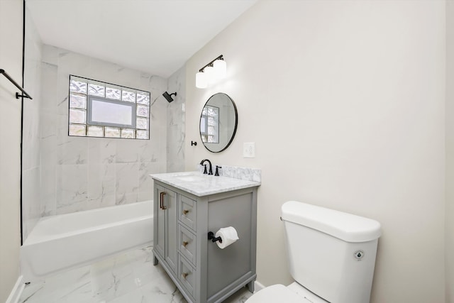 full bathroom featuring vanity, toilet, and tiled shower / bath