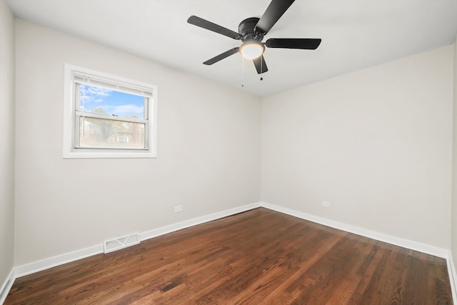 unfurnished room featuring ceiling fan and dark wood-type flooring