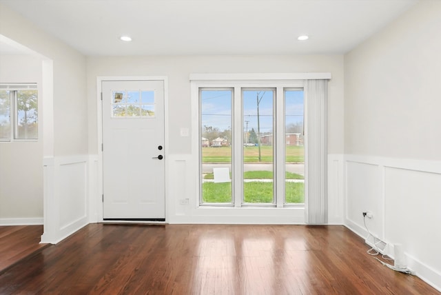 entryway with plenty of natural light and dark wood-type flooring