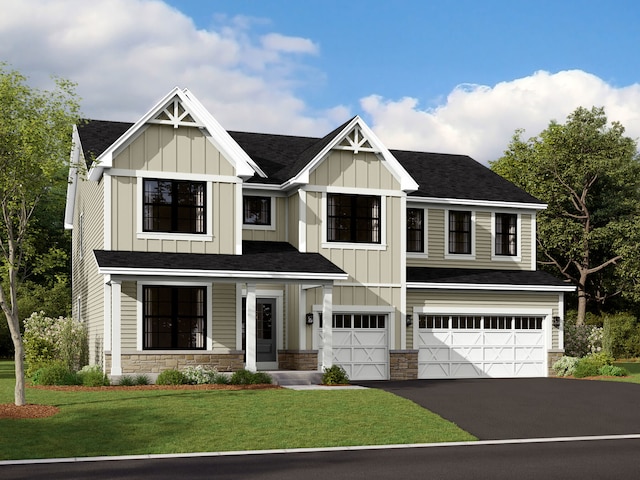 view of front of house featuring a front yard and a garage