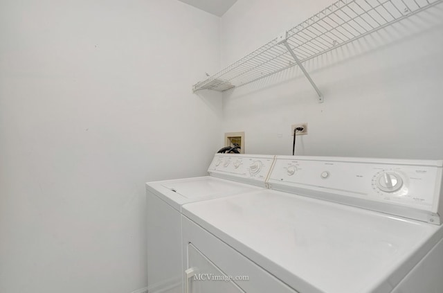 washroom featuring laundry area and independent washer and dryer