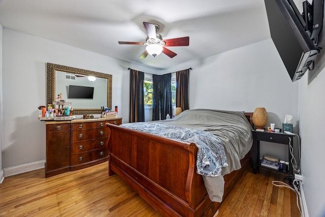 bedroom featuring light wood-type flooring and ceiling fan