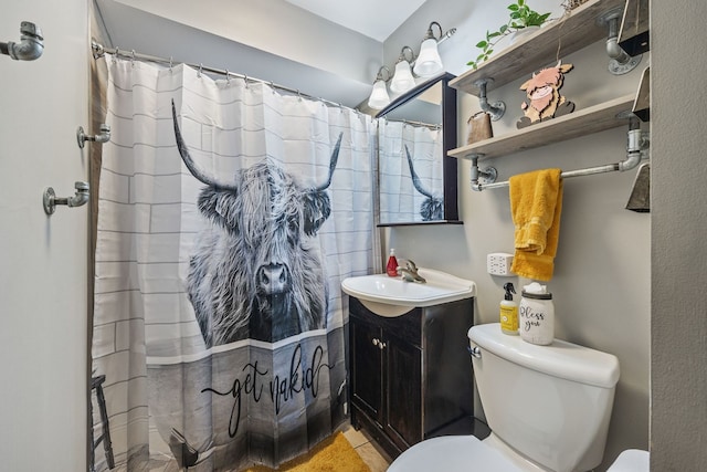 bathroom with walk in shower, vanity, and toilet