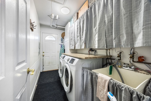 washroom with washer and clothes dryer and carpet