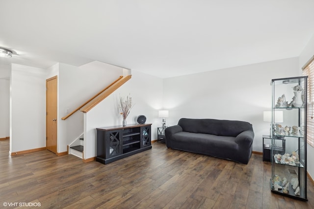 living room with dark hardwood / wood-style flooring