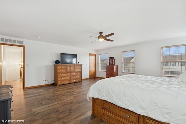 bedroom with ceiling fan and dark hardwood / wood-style floors