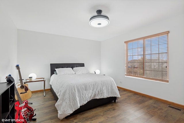 bedroom featuring dark hardwood / wood-style flooring