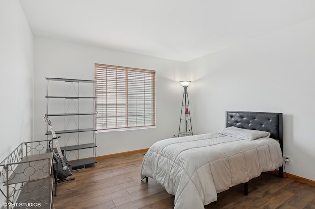 bedroom with hardwood / wood-style flooring