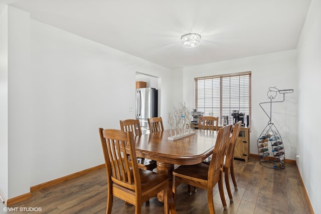 dining room with dark hardwood / wood-style floors