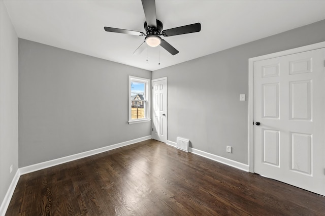 unfurnished room featuring ceiling fan and dark hardwood / wood-style flooring