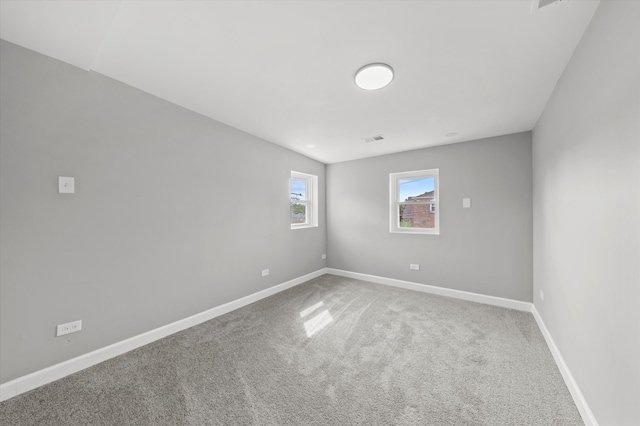 empty room with carpet flooring