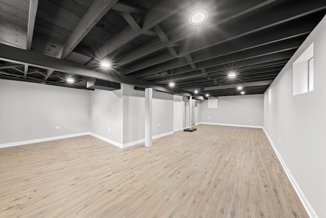 basement featuring wood-type flooring