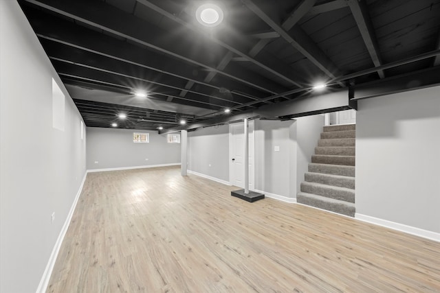 basement featuring hardwood / wood-style flooring