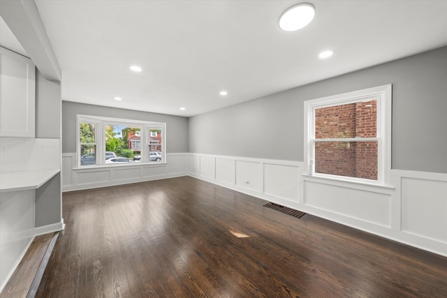 unfurnished living room featuring hardwood / wood-style floors