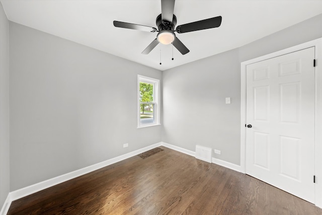 unfurnished bedroom featuring dark hardwood / wood-style flooring and ceiling fan