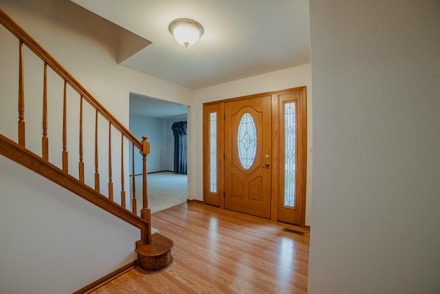 entrance foyer with light hardwood / wood-style flooring