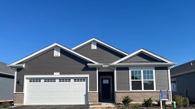 craftsman inspired home featuring a garage