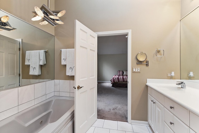 bathroom featuring tile patterned floors, a bathtub, and vanity