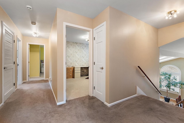 hallway with carpet