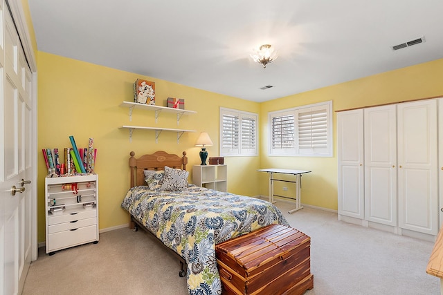 bedroom with light colored carpet