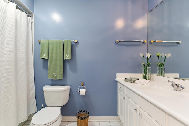 bathroom featuring tile patterned flooring, vanity, and toilet