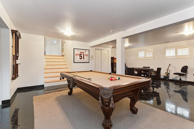 playroom with dark tile patterned flooring and pool table