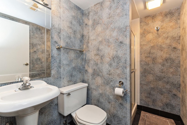 bathroom featuring tile patterned floors, sink, and toilet