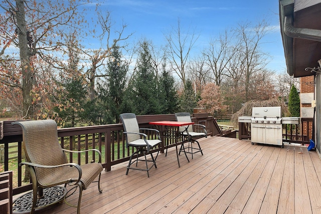 wooden deck featuring area for grilling