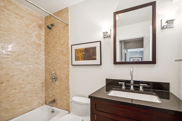 full bathroom featuring vanity, toilet, and tiled shower / bath combo