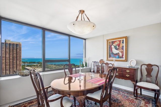 dining room featuring a water view