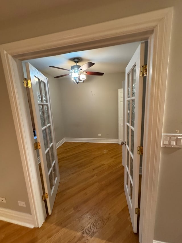 interior space featuring ceiling fan, hardwood / wood-style floors, and french doors