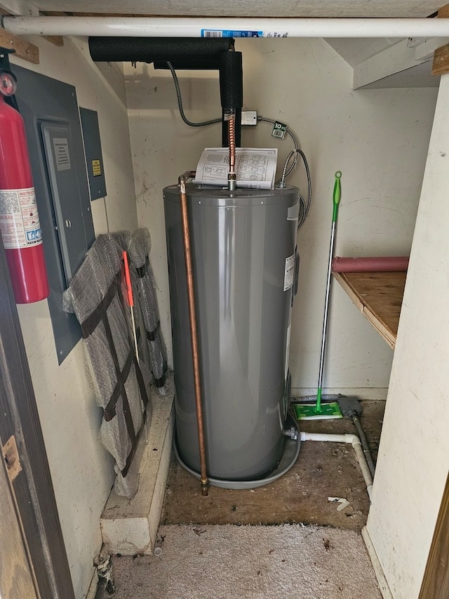 utility room featuring water heater