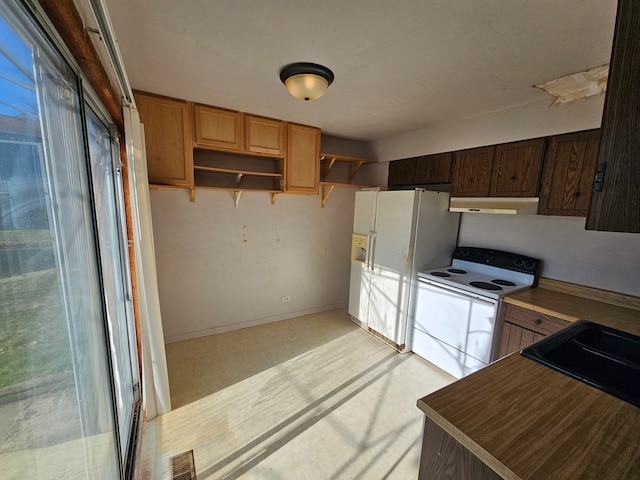 kitchen with white appliances and sink