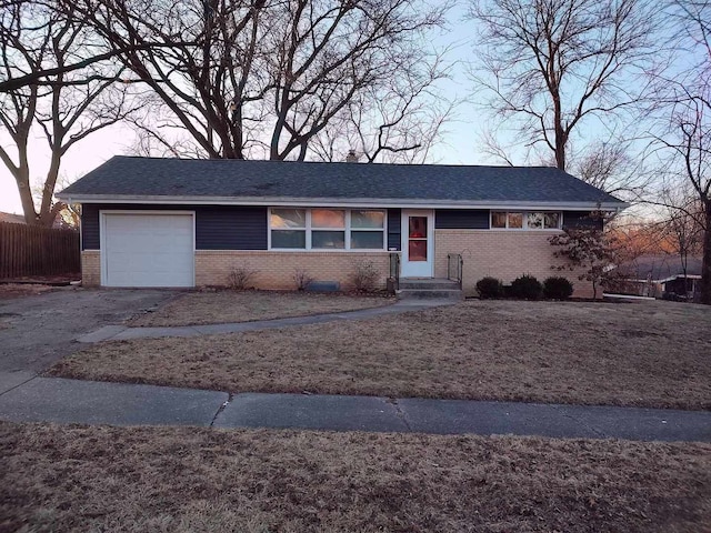 ranch-style house featuring a garage