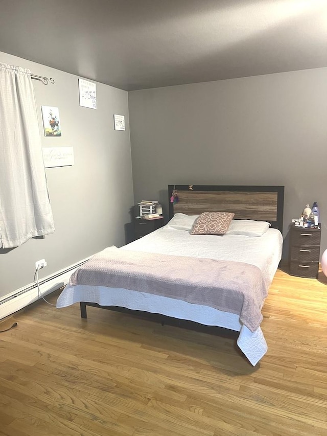 bedroom with wood-type flooring