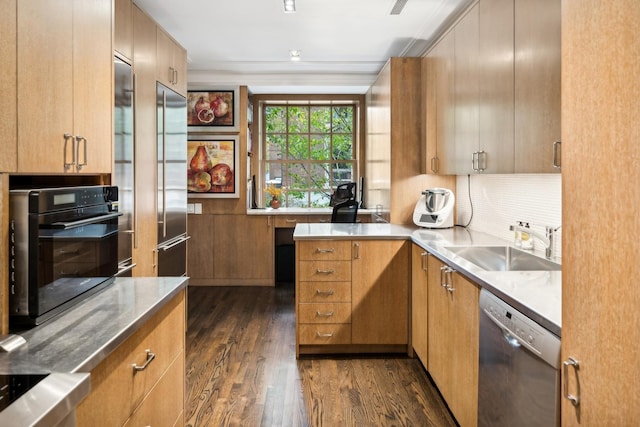 kitchen with sink, dark hardwood / wood-style flooring, crown molding, and appliances with stainless steel finishes