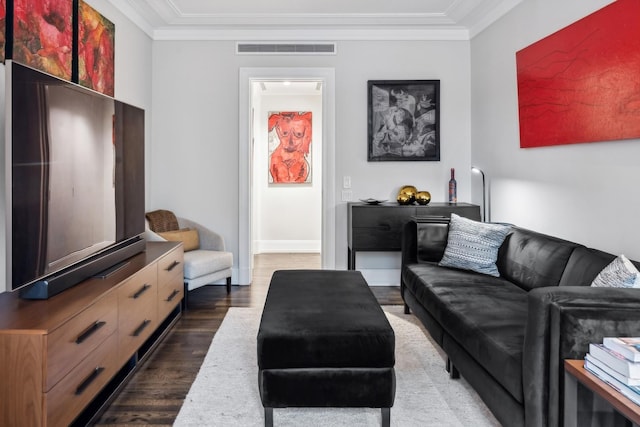 living room with dark hardwood / wood-style flooring and ornamental molding