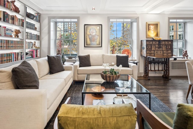 living room featuring plenty of natural light, dark hardwood / wood-style flooring, and ornamental molding