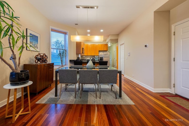 dining area featuring dark hardwood / wood-style floors