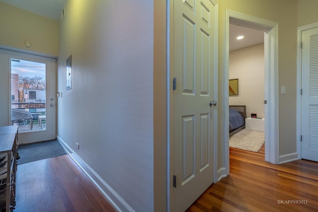 hall featuring dark wood-type flooring