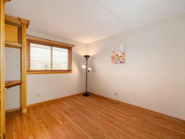 spare room with light hardwood / wood-style floors