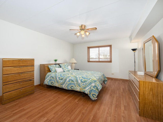 bedroom featuring light hardwood / wood-style floors and ceiling fan