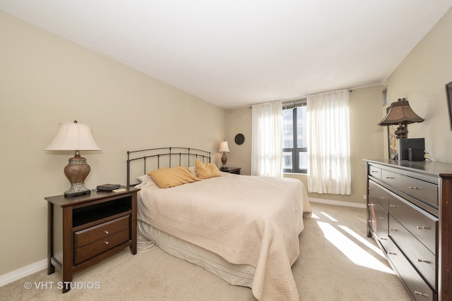 bedroom with light carpet