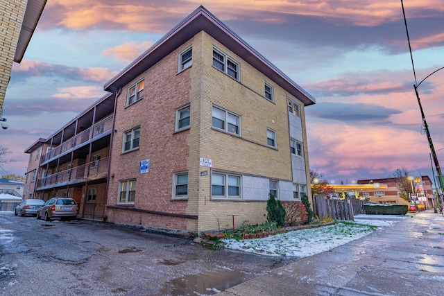 view of outdoor building at dusk