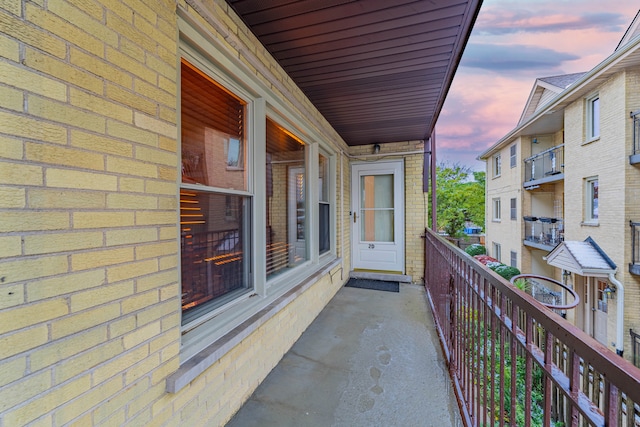 view of balcony at dusk